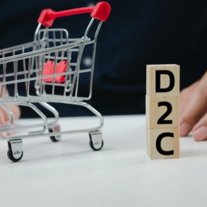 what is d2c thumbnail - a miniature shopping cart near cubes with writing D2C